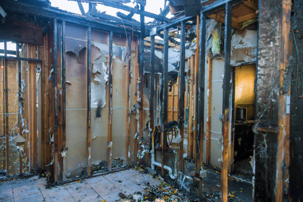 Professional Fire Damage Restoration technician working in Burt, MI